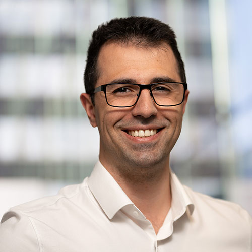 Portrait photo of Cem Özcan, author of the article on Multi-Agent Language Models and AI-powered document generation.